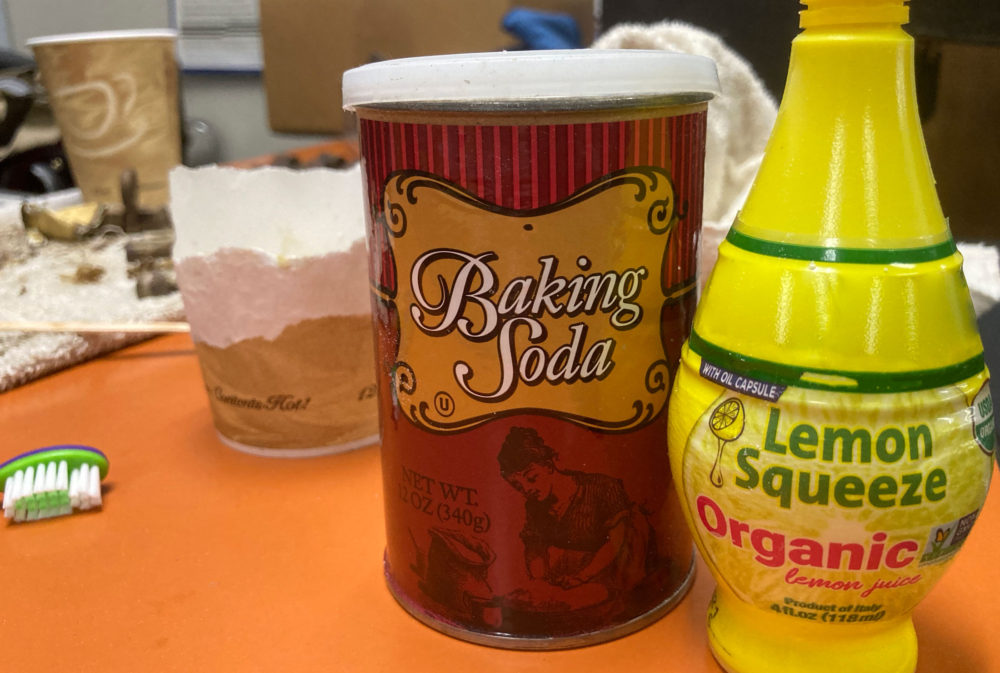 Mix equal parts baking soda and limon juice to make a paste to apply to vintage brass hardware after you have peeled most of the paint away.